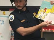 Chief reading to kids